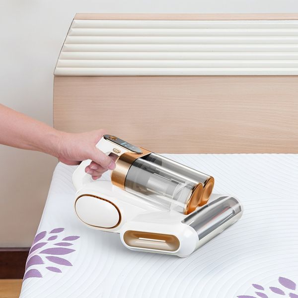 Actual beige and copper mattress vacuum on bedding